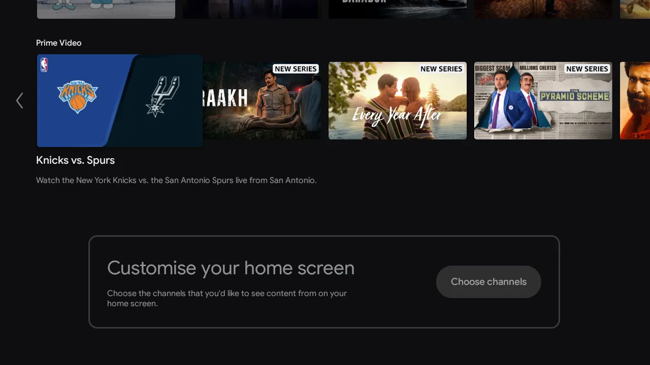 The stock Mi TV home screen still showing recommendation rows and sponsored content.